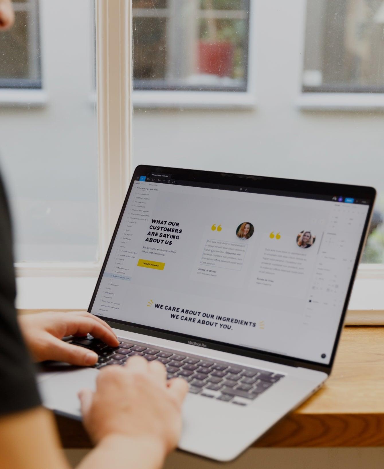 Customer reviews and social proof displayed on a business website viewed on a laptop